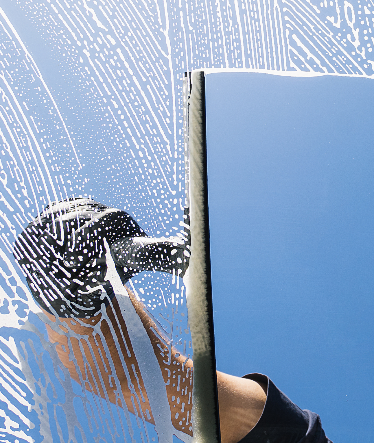 Photo of a Squeegee cleaning a window